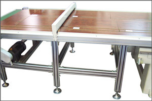 The front conveyor includes a down draft vacuum trough